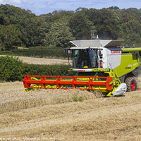 Buy canvas prints of A Cllaas lexion 570 Combine Harvester  by Michael Harper