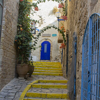 Buy canvas prints of A colourful narrow street and steps in Jaffa Israel by Michael Harper