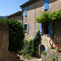 Buy canvas prints of Traditional French house with shutters and Arch do by Michael Harper