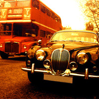 Buy canvas prints of Jaguar and bus by david harding