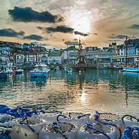 Buy canvas prints of Brixham Harbour with a Setting Sun by Gordon Dimmer