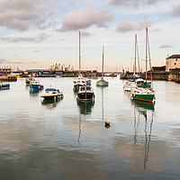 Buy canvas prints of Reflections of Brixham Harbour by Gordon Dimmer
