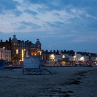 Buy canvas prints of Weymouth Beach calm before the storm by Paul Brewer