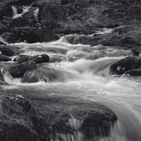 Buy canvas prints of Flowing River at Pen-y-Gwryd in Snowdonia National by Paul Brewer
