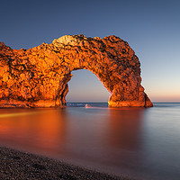 Buy canvas prints of Durdle Door Dorset with an illuminated Canoeist   by Paul Brewer
