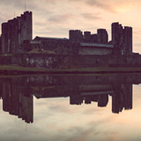 Buy canvas prints of Caerphilly Castle at Sunset  by Paul Brewer