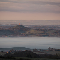 Buy canvas prints of Glastonbury Tor at Sunrise surrounded by mist  by Paul Brewer