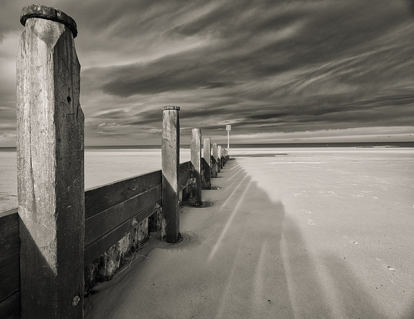  Redcar Beach Groynes with windy skies Picture Board by Greg Marshall