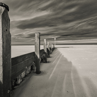 Buy canvas prints of  Redcar Beach Groynes with windy skies by Greg Marshall