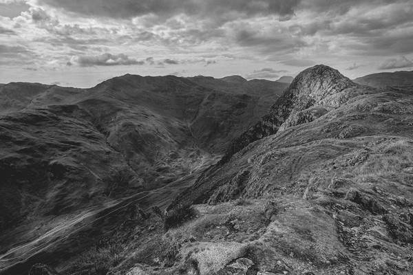 View of Pike o' Stickle and Crinkle Crags black Picture Board by Greg Marshall