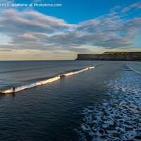 Buy canvas prints of Surfers at Saltburn, Teesside / North Yorkshire at sunset. by Greg Marshall