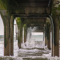 Buy canvas prints of Waves under the pier by Phil Wareham