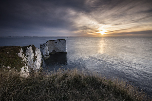 Sunrise through the clouds Picture Board by Phil Wareham