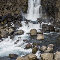 Buy canvas prints of Waterfall at Thingvellir National Park by Phil Wareham