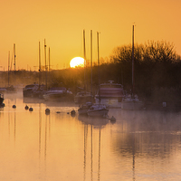 Buy canvas prints of  Sunrise over the moorings by Phil Wareham