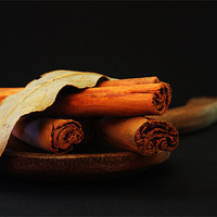 Buy canvas prints of Wooden spoon and Cinnamon by Clare Colins
