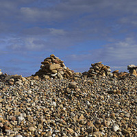 Buy canvas prints of Cobble Cairns on Holy Isle  by Donald Parsons