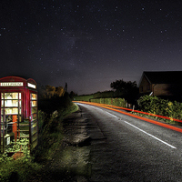 Buy canvas prints of Rundown Phonebox By Night by Malcolm Wood