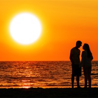 Buy canvas prints of FLIRTING AT THE BEACHS SUNSET by Ankor Light