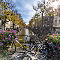 Buy canvas prints of Iconic Amsterdam canal view with bicycle parked be by Ankor Light