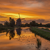 Buy canvas prints of Windmill at the warm and red color sunrise in Haze by Ankor Light