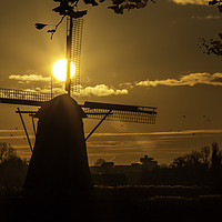Buy canvas prints of Windmill at the warm and red color sunrise by Ankor Light