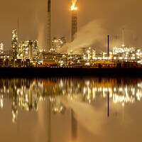 Buy canvas prints of Refineries reflection and its chimney during the on fire sunset golden hour moment at Rotterdam, Netherlands by Ankor Light