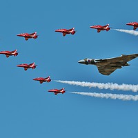 Buy canvas prints of Avro Vulcan Bomber & The Red Arrows by Shawn Nicholas