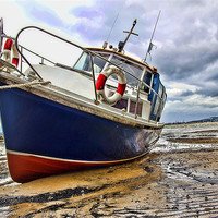 Buy canvas prints of Estuary Boat at Low Tide by Andy Anderson