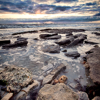 Buy canvas prints of Western Australia Rocky Beach at Sunset by Andy Anderson