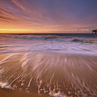 Buy canvas prints of Colourful Pier Sunrise by Jennie Franklin