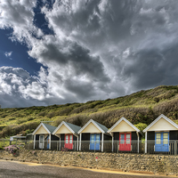 Buy canvas prints of Clouds, beach huts and light by Jennie Franklin