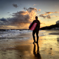 Buy canvas prints of  Surfer at Sundown by Jennie Franklin