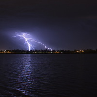 Buy canvas prints of  Lightning at the lake by Matthew Burniston