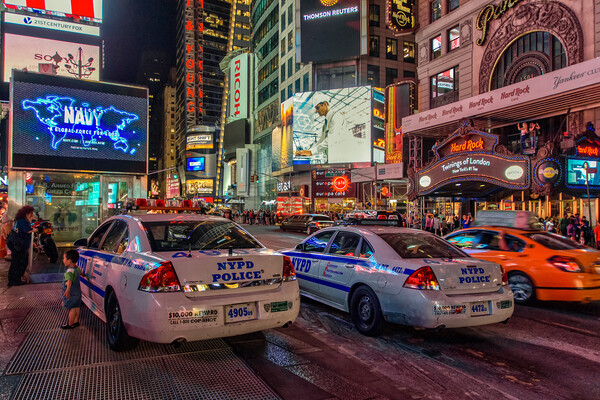 NYPD watch over Times Square.  Picture Board by Alan Matkin