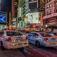 Buy canvas prints of NYPD watch over Times Square.  by Alan Matkin