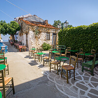 Buy canvas prints of Greek Outdoor dining tables on Alonissos (Sporades by Alan Matkin