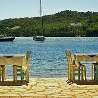 Buy canvas prints of Kioni harbour side dining by Alan Matkin