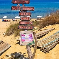 Buy canvas prints of Mandraki beach beach sign Skiathos. by Alan Matkin