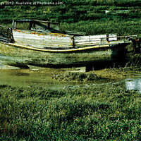 Buy canvas prints of Old Boat Stranded in Mud by JG Mango
