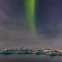 Buy canvas prints of Northern Lights above the Jökulsárlón ice lagoon by Steve Hughes