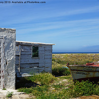 Buy canvas prints of Old fishing boat and sheds by Digby Merry