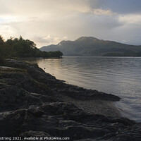 Buy canvas prints of Sunset behind Loch Lomond, Luss, Scotland by Simon Armstrong