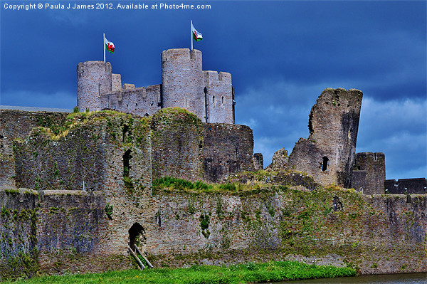 Stormy skies at Caerphilly Castle Picture Board by Paula J James