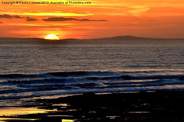 Sunset behind the Gower Peninsula Picture Board by Paula J James