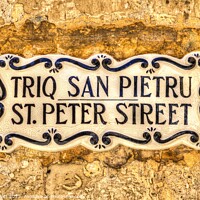 Buy canvas prints of St Peter Street Sign Malta  by David Pyatt