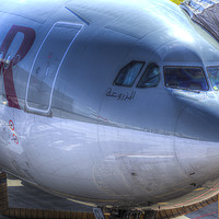 Buy canvas prints of Qatari Airlines Boeing 777-300ER by David Pyatt