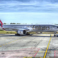 Buy canvas prints of Emirates Boeing 777-300ER by David Pyatt