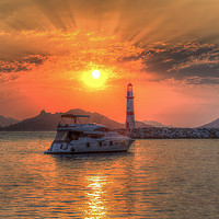 Buy canvas prints of Lighthouse And Yacht Sunset by David Pyatt