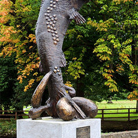 Buy canvas prints of Brown Trout Statue by John McCoubrey